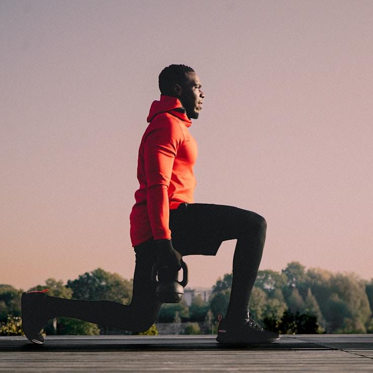 Interior of a professional gym with weight training equipment and mirrors